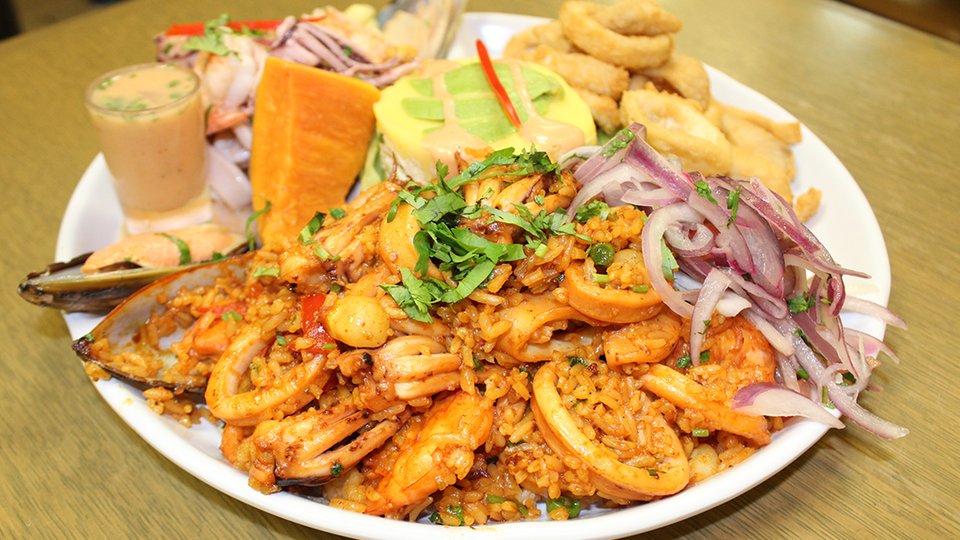 Peruvian restaurant interior with warm lighting.